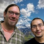 Victor and Ryan smile in front of Denali.