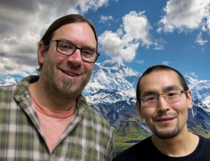 Victor and Ryan smile in front of Denali.