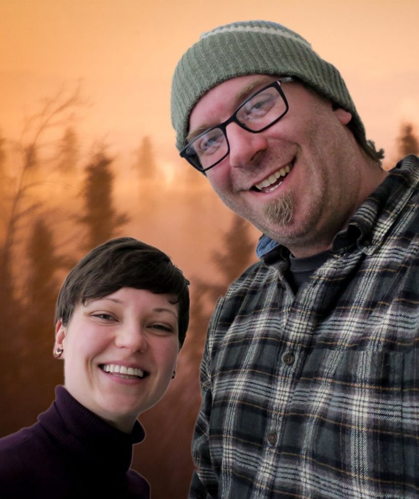 Erica, a young woman with short brown hair, and Ryan, a man with a goatee and glasses, smile in front of a photoshopped background of smokey trees.